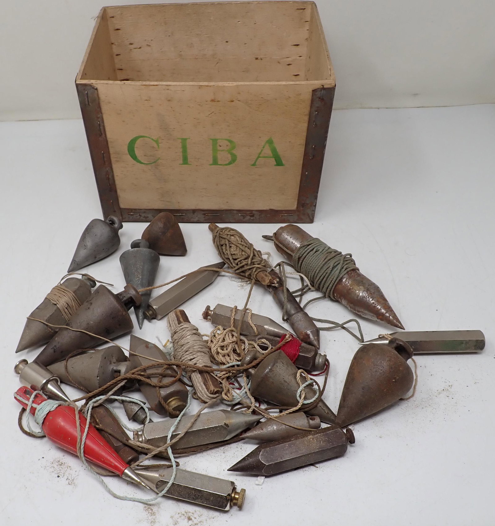 Pile of Plumb Bobs: includes Ciba box