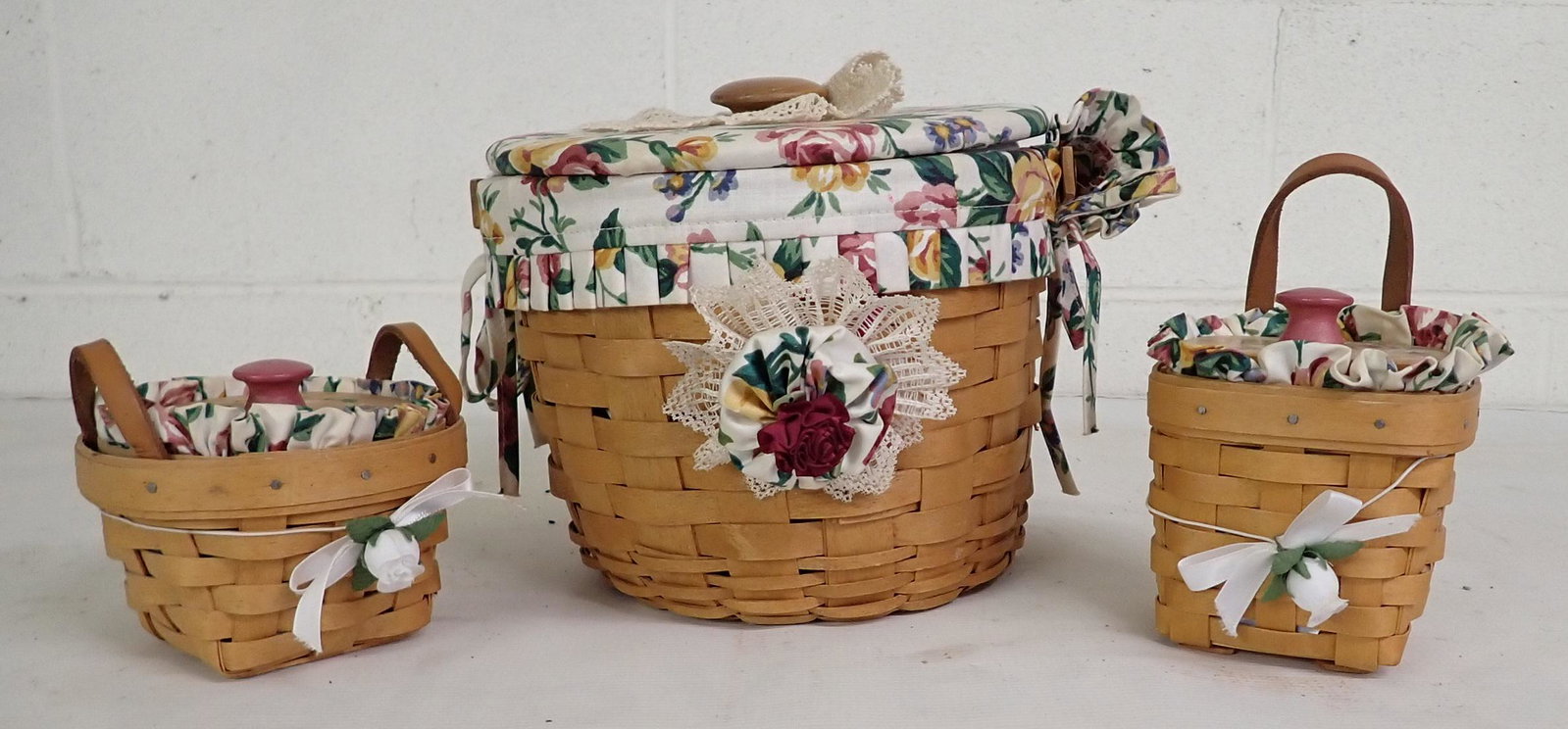 3 Longaberger Baskets: Largest is approx 8 1/2" in diameter and 7" tall. All have protectors and liners