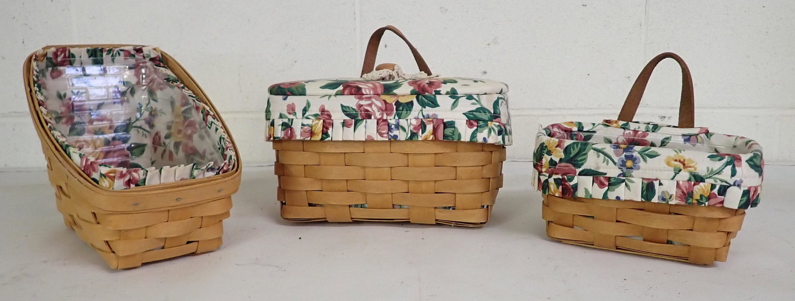 3 Longaberger Baskets: Left one is approx 6" x 10 1/2" x 7 1/4" tall. All have protectors and liners