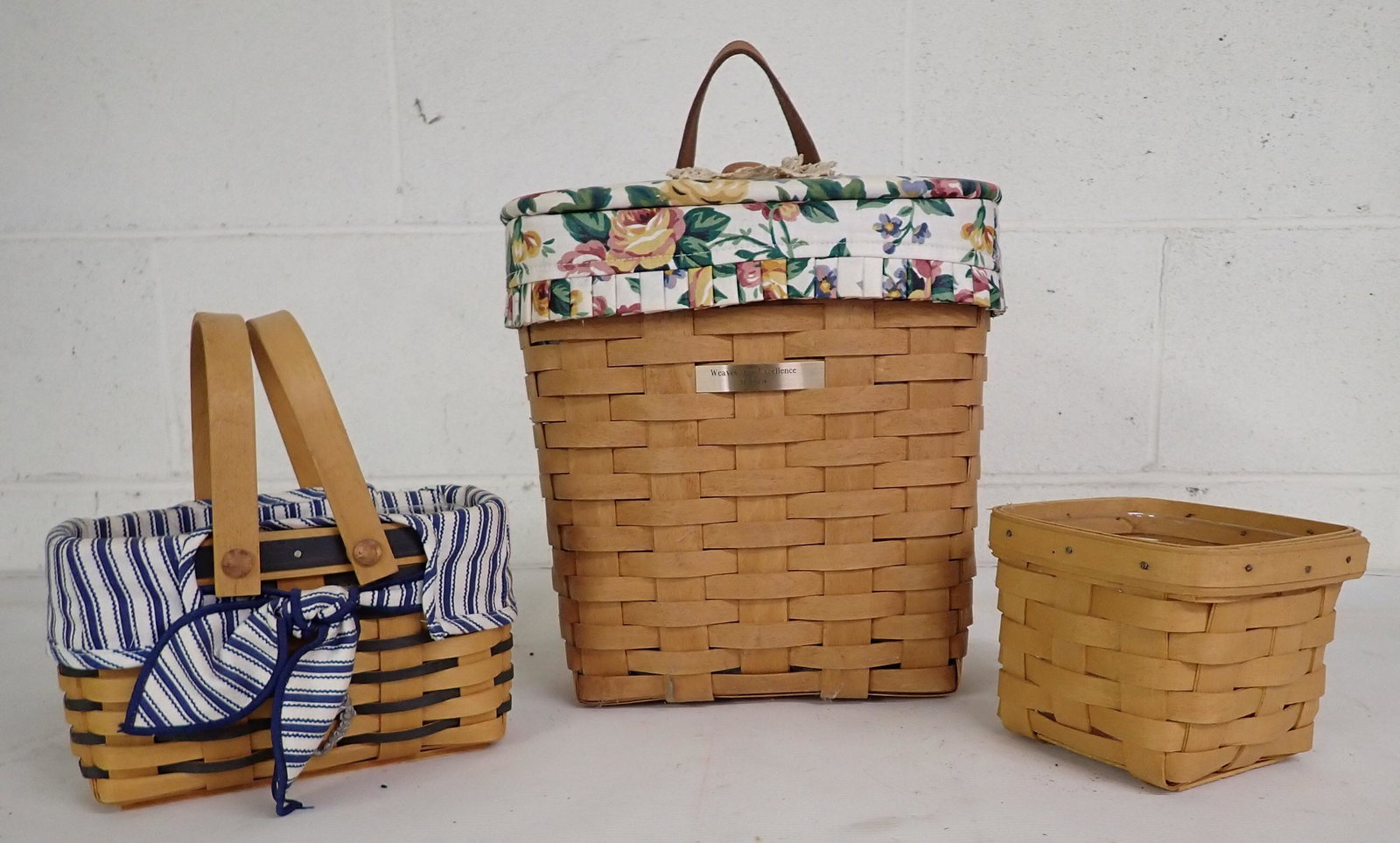 3 Longaberger Baskets: Largest is apprx 5 1/2" x 10" x 10" tall. Tallest has liner, one on right has protector, left one has both