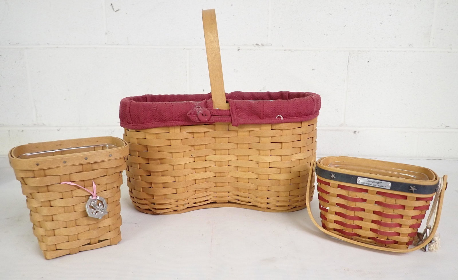 3 Longaberger Baskets: Largest is apprx 6 7/8" x 12 1/2" x 7 1/4" tall. All have protectors.