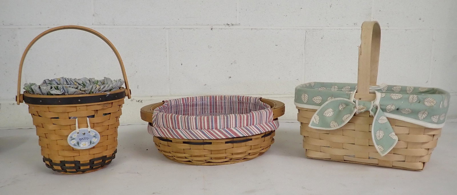 3 Longaberger Baskets: Middle one is approx 10 3/4" in diameter and 4" tall. All have protectors and liners
