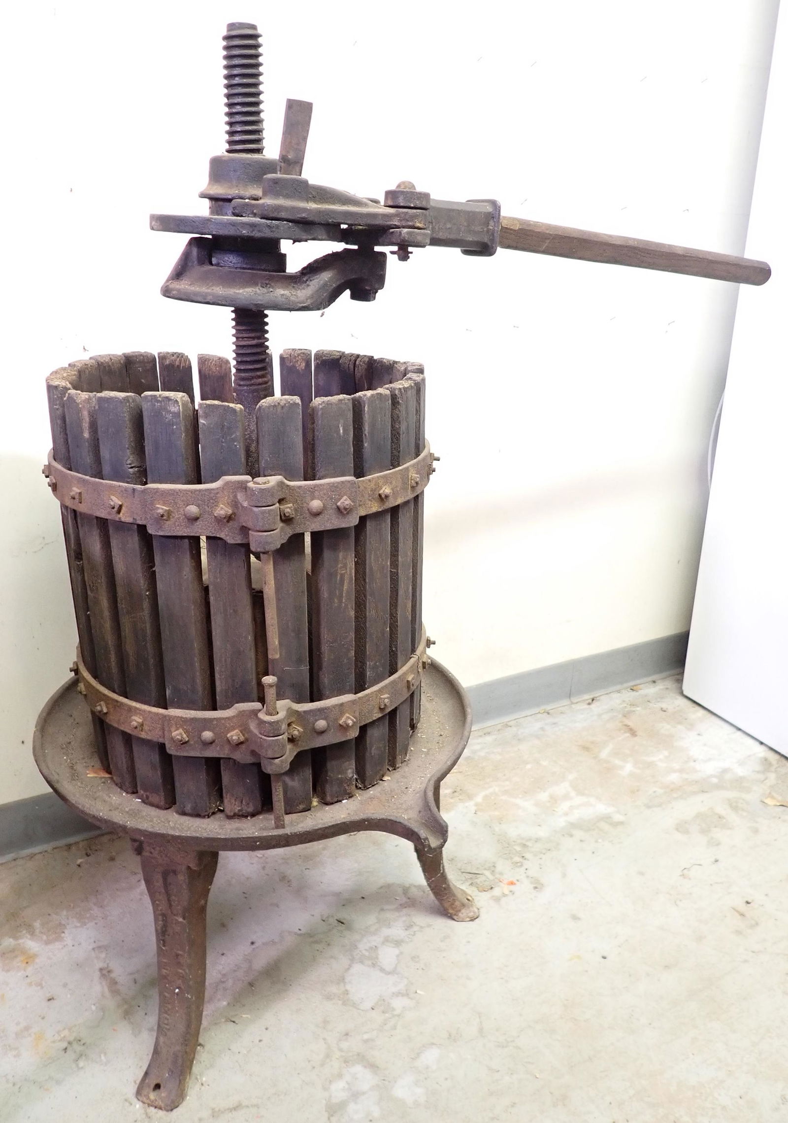 Antique Wine Press: Cast Iron is approx 20" in diameter. Total height is approx 46"