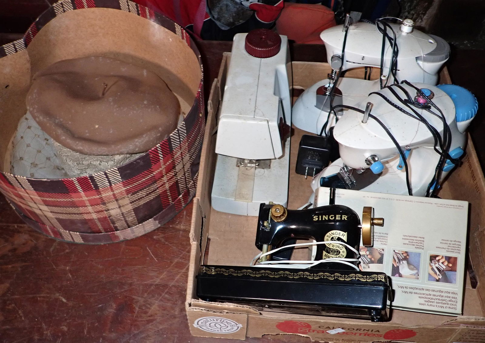 Sewing Machines and Hats: Black singer is a childs , plastic toy. No shipping !