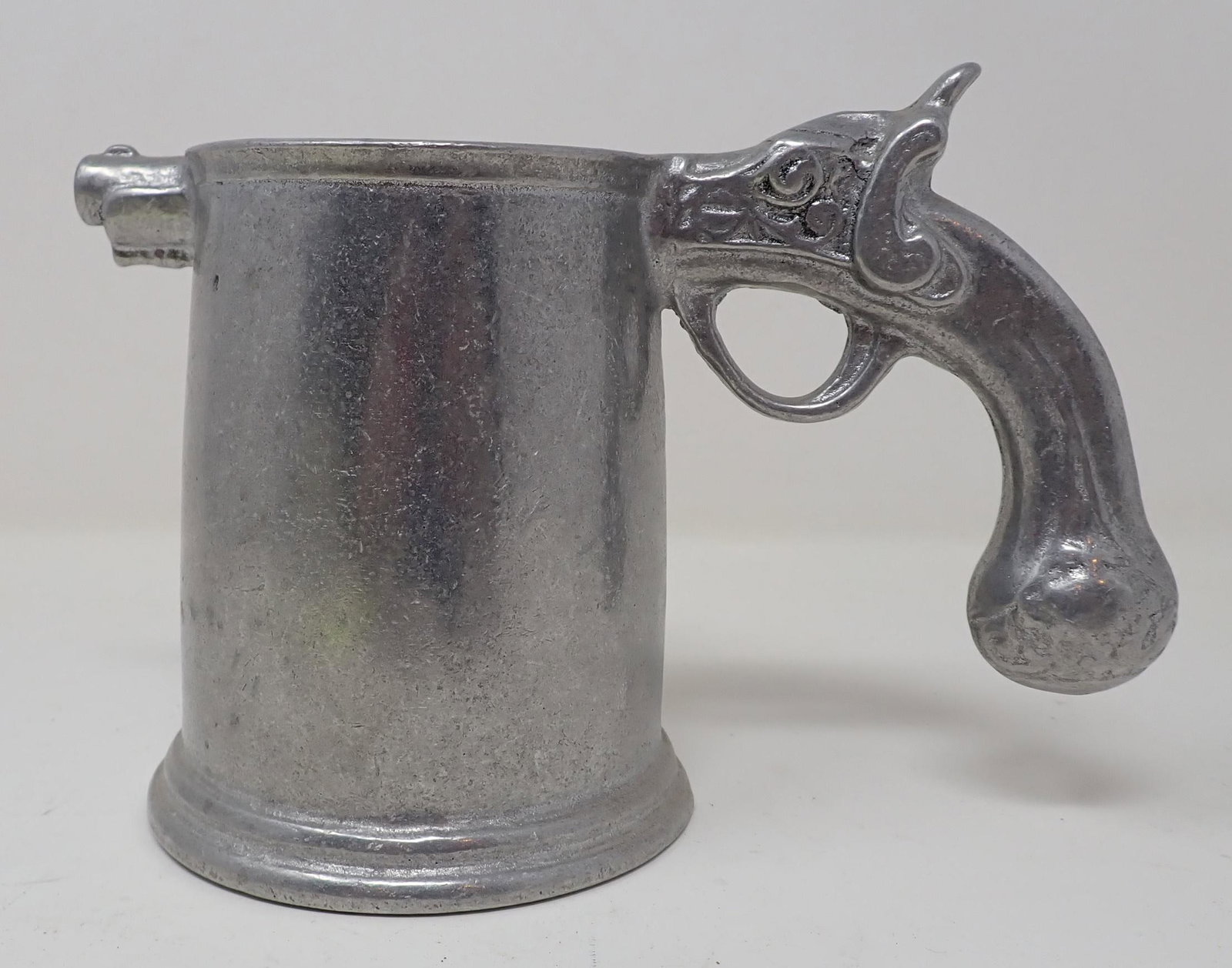 Aluminum Gun Stein: Approx 4" in diameter and 4 5/8" tall. Inscribed " Warren" on one side.