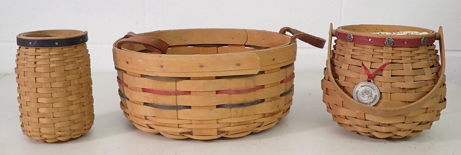 3 Longaberger Baskets: Largest is apprx 10" in diameter and 4 1/2" tall