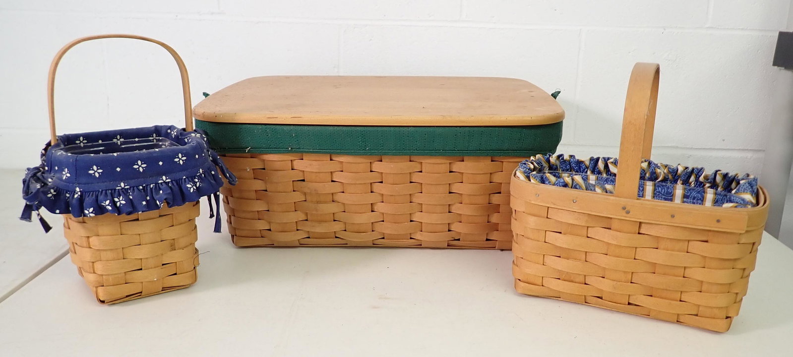 3 Longaberger Baskets: Largest is apprx 14 1/2" x 17 1/2" x 7" tall. All have protectors and liners