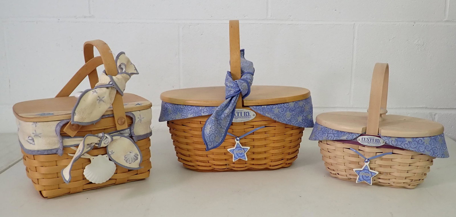 3 Longaberger Baskets: All have protectors and liners. Center one is approx 6 1/4" x 10 1/2" x 10 1/2" tall ( to top of handle).