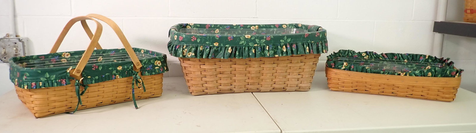 3 Longaberger Baskets: Largest is approx 17 1/2" x 24" x 9 1/2" tall. All have protectors and Liners