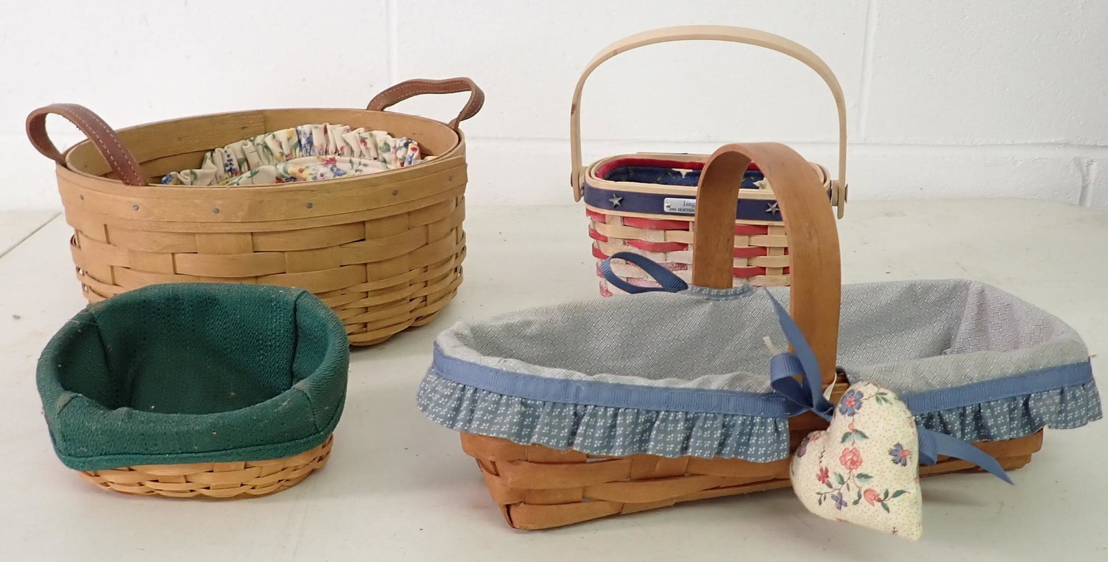 4 Longaberger Baskets: Largest is apprx 9 5/8" in diameter and 4 1/4" tall.