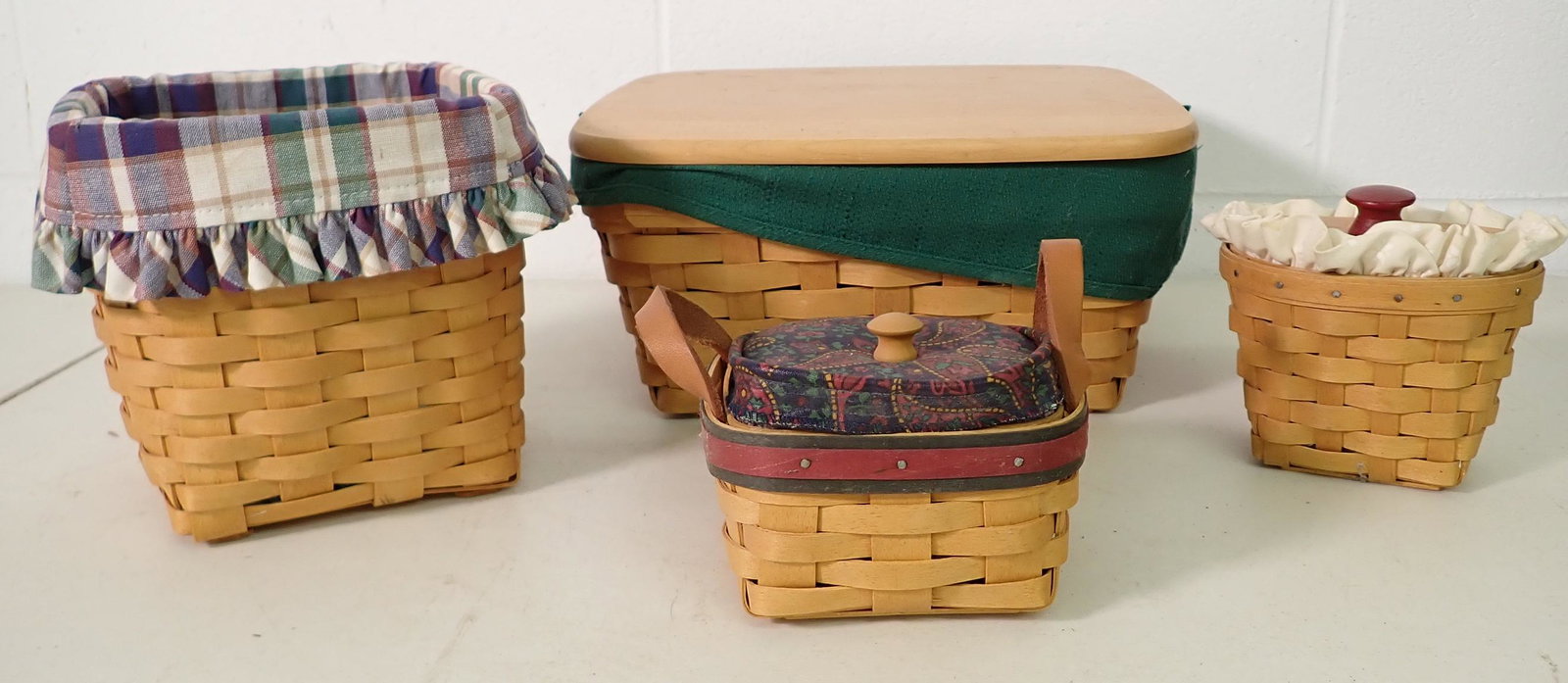4 Longaberger Baskets: Largest is approx 10" x 11" x 5 1/2" tall. All have liners