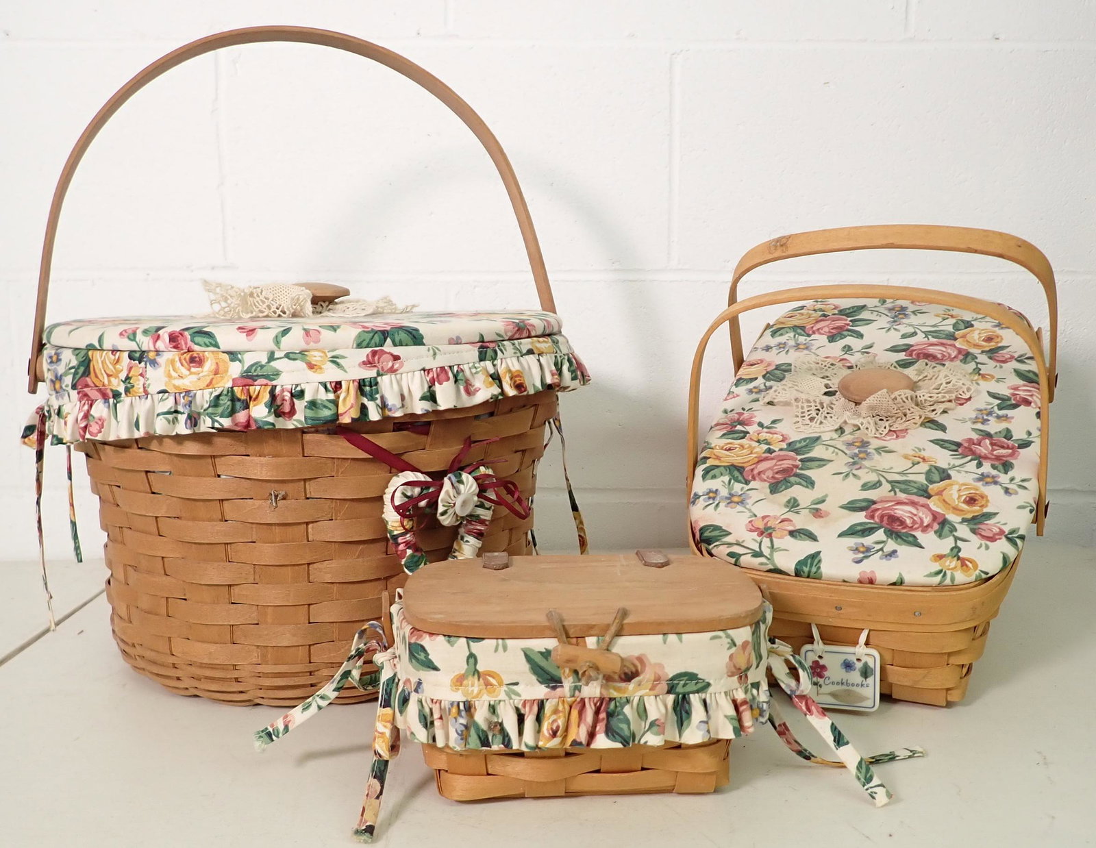 3 Longaberger Baskets: Back left one is approx 13" in diameter and 9" tall. 2 Largest have protectors and liners. Cound not open the front one without breaking the leather.