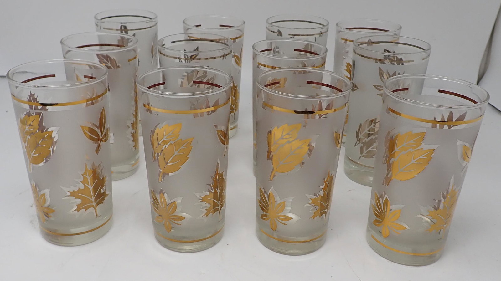 Vintage Frosted Leaf Pattern Glasses: There are 4 silver and 8 gold. Drinking glasses are approx 2 3/4" in diameter and 5 1/2" tall. NO SHIPPING !