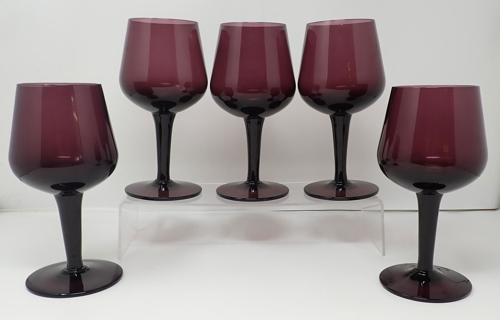 5 Amethyst Glass Goblets: Approx 3 3/4" in diameter at widest point and 7 3/4" tall.