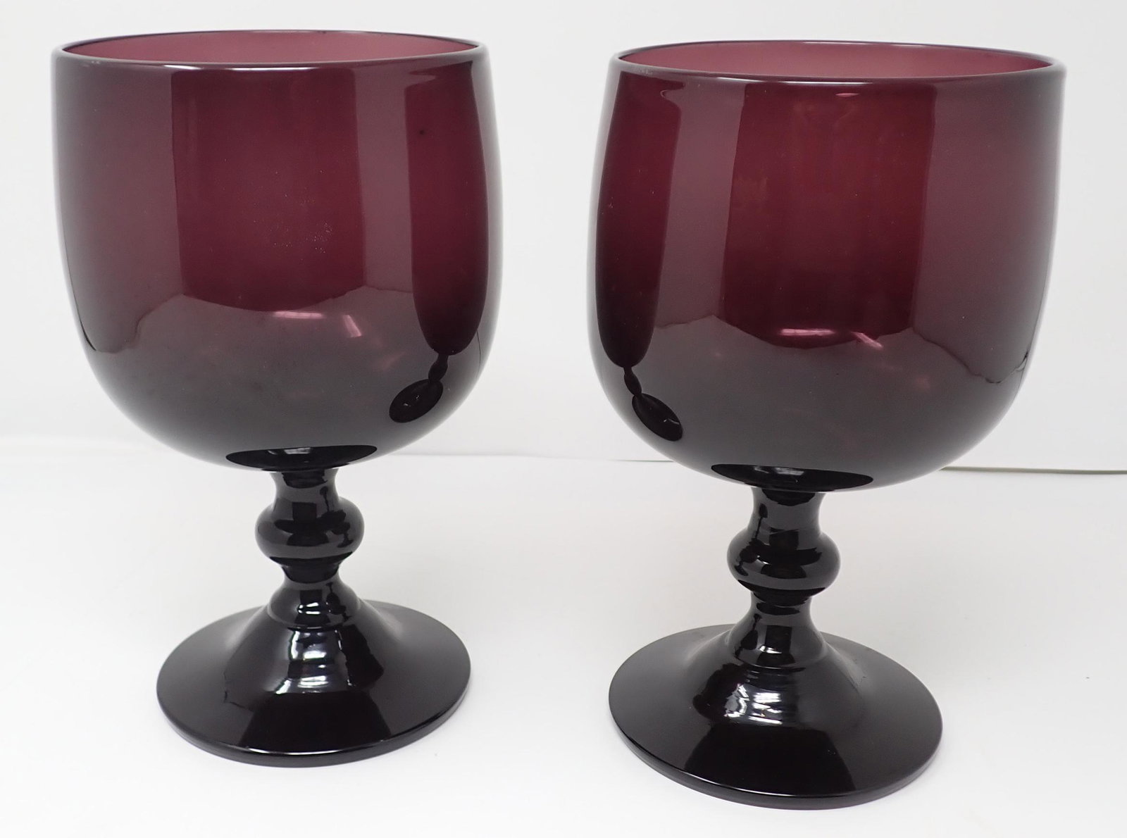 Pair of Hand Blown Amethyst Goblets: Apprx 4 3/4" in diameter and 8" tall.