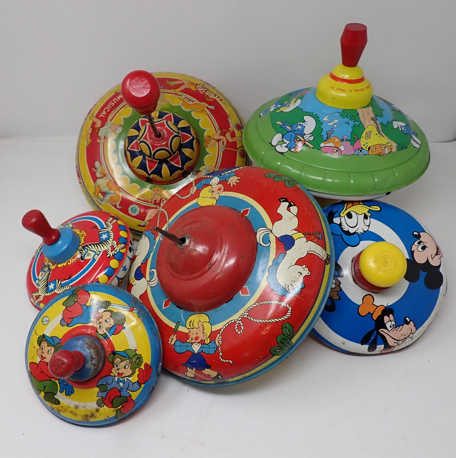 Smurfs Wyandotte & Misc Spinning Tops: Largest top is approx 8 1/2" in diameter