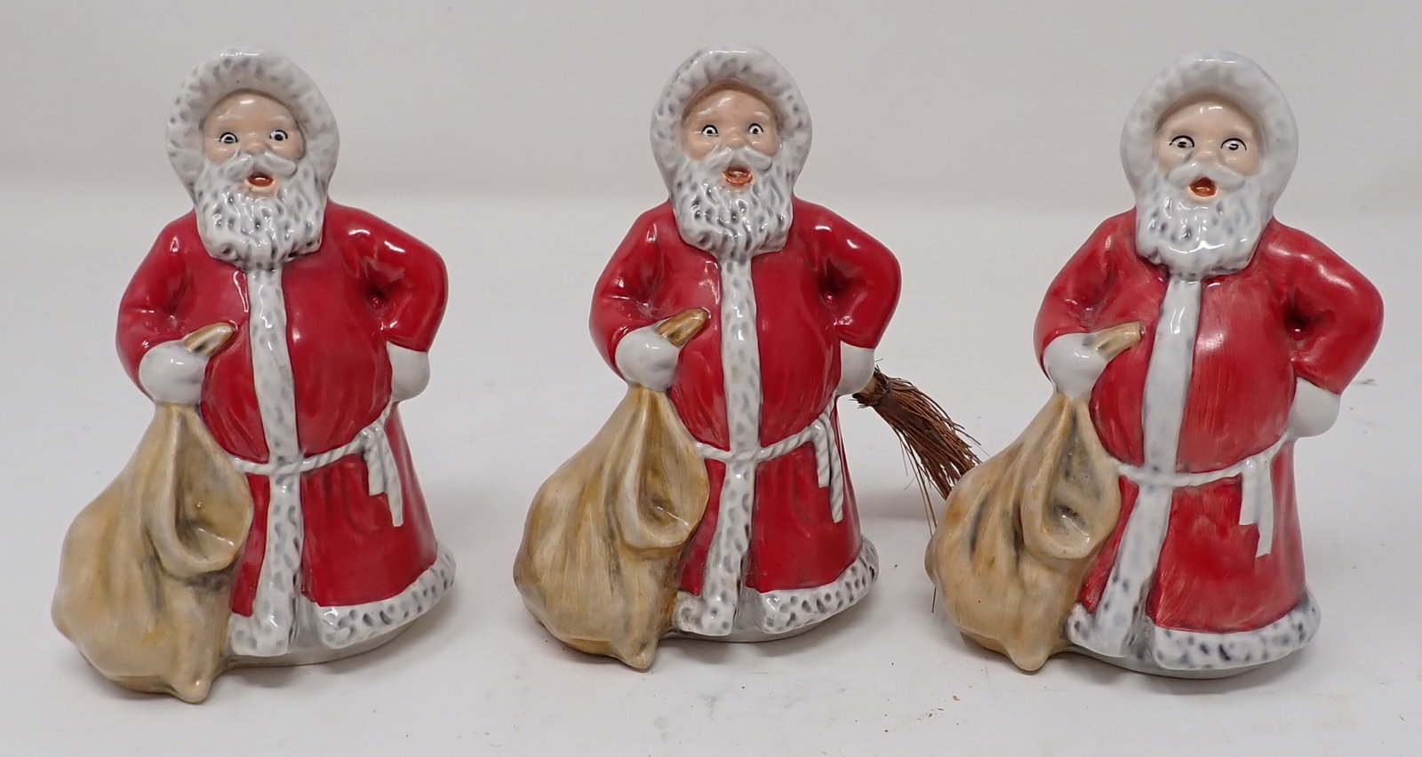 (3) 1975 Goebel Santas: Approx 4" tall. Only one has broom
