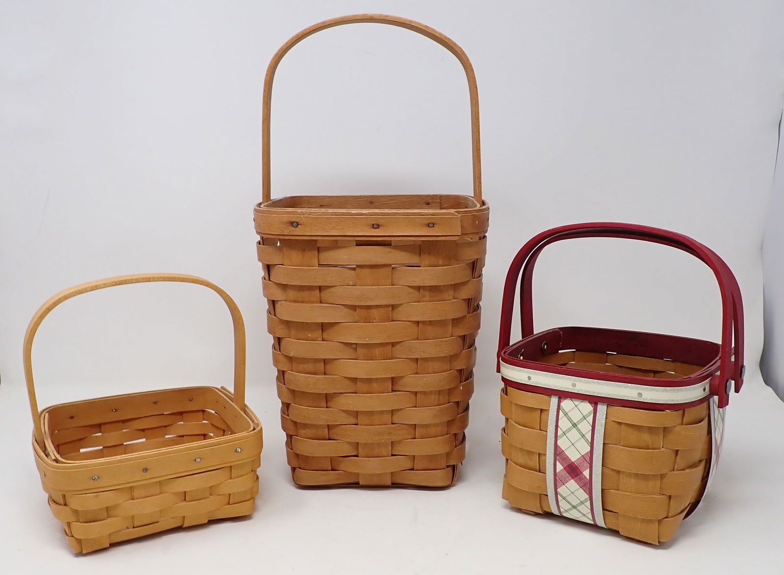 3 Longaberger Baskets: Largest is approx 6 1/2" x 6 3/4" x 13 1/2" tall.