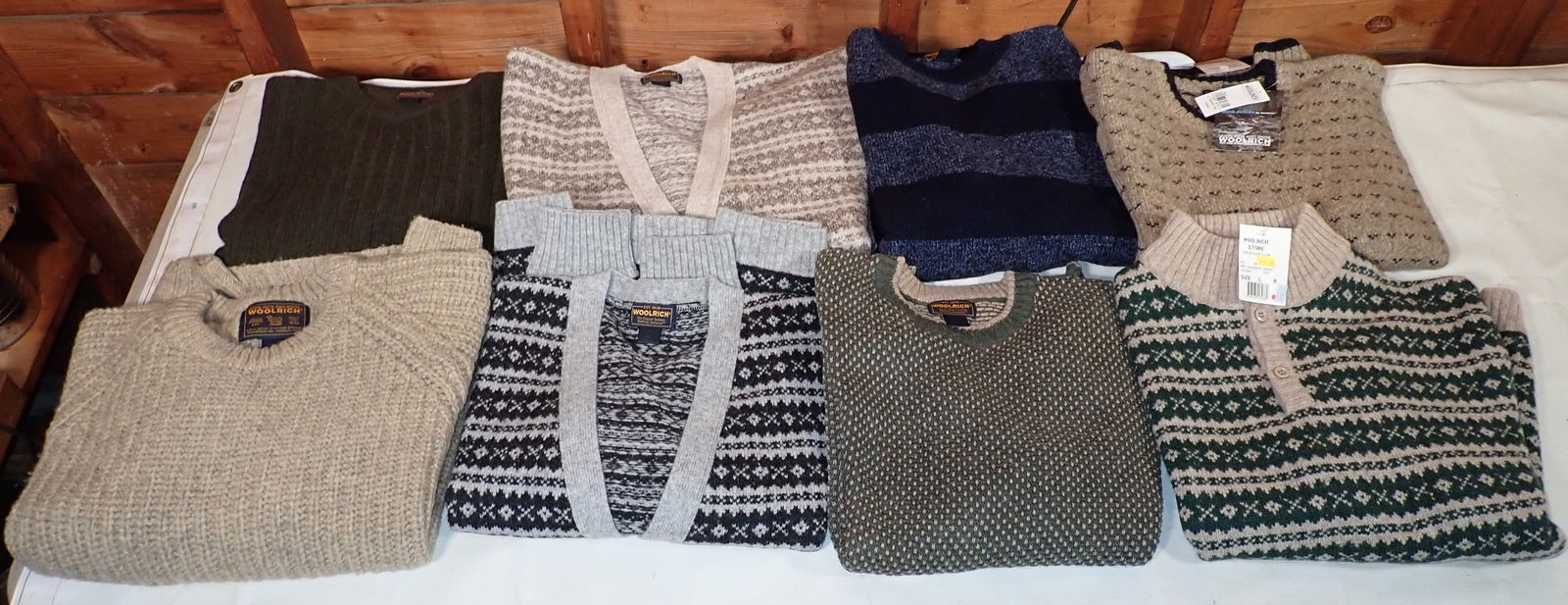 8 Woolrich Sweaters: 2 on far right still have tags.