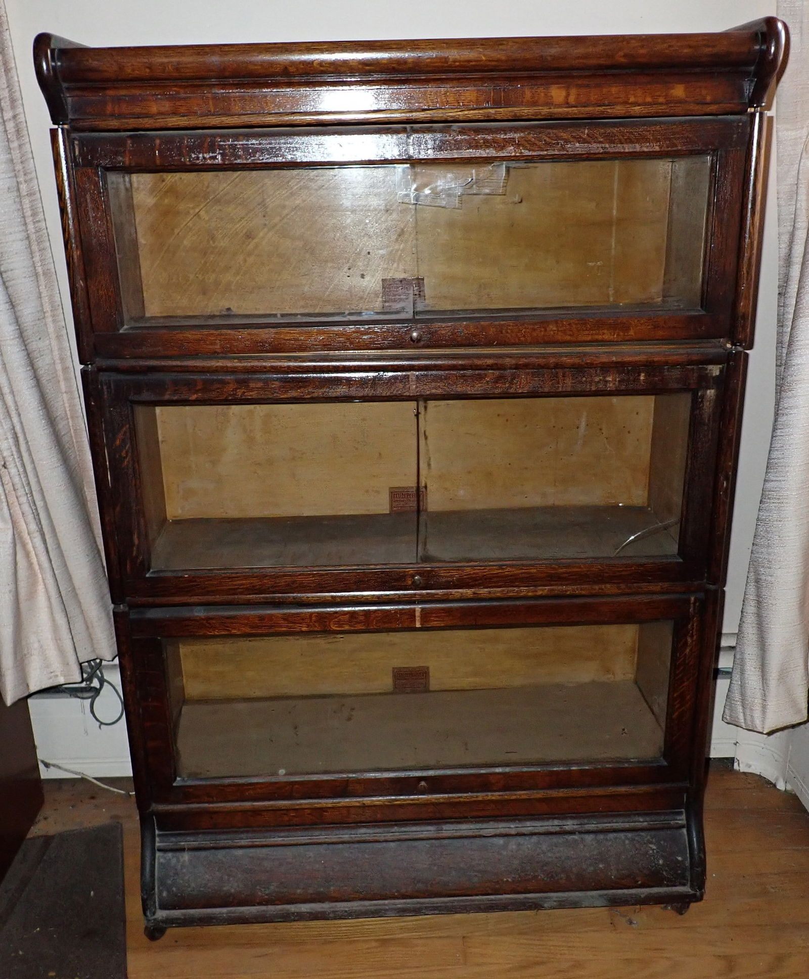 Humphrey Sectional Stack Bookcase: Approx 14" x 34 1/8"x 51" tall. Has casters on bottom and rolls good. No shipping !