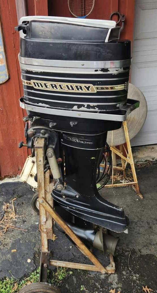 Early 70's 65hp Mercury Outboard Boat Motor: 4 cylinder motor. Was stored in barn for 40 years. No shipping ! Bring proper help to load !