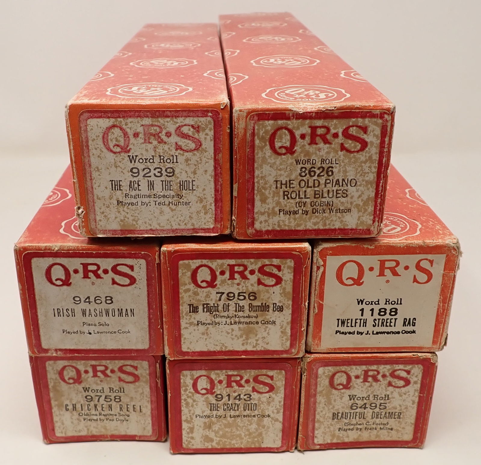 8 QRS Player Piano Rolls: We do not guarantee correct roll is in correct box. Sold as pictured