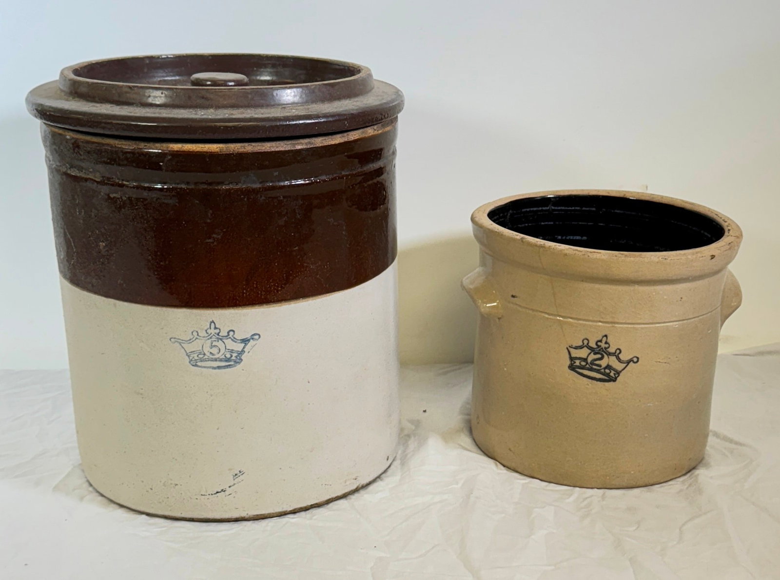 2 Stoneware Crocks: Largest is approx 11 3/4" in diameter and 12 1/2" tall. NO shipping
