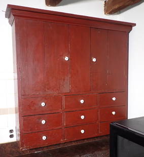 9 Drawer 2 Door Wall Cupboard in Red Paint: Approx 8" x 38" x 38" tall. Bring help and phillips screwdriver to remove from wall. No shipping ! Buyer to pick up on day 2.