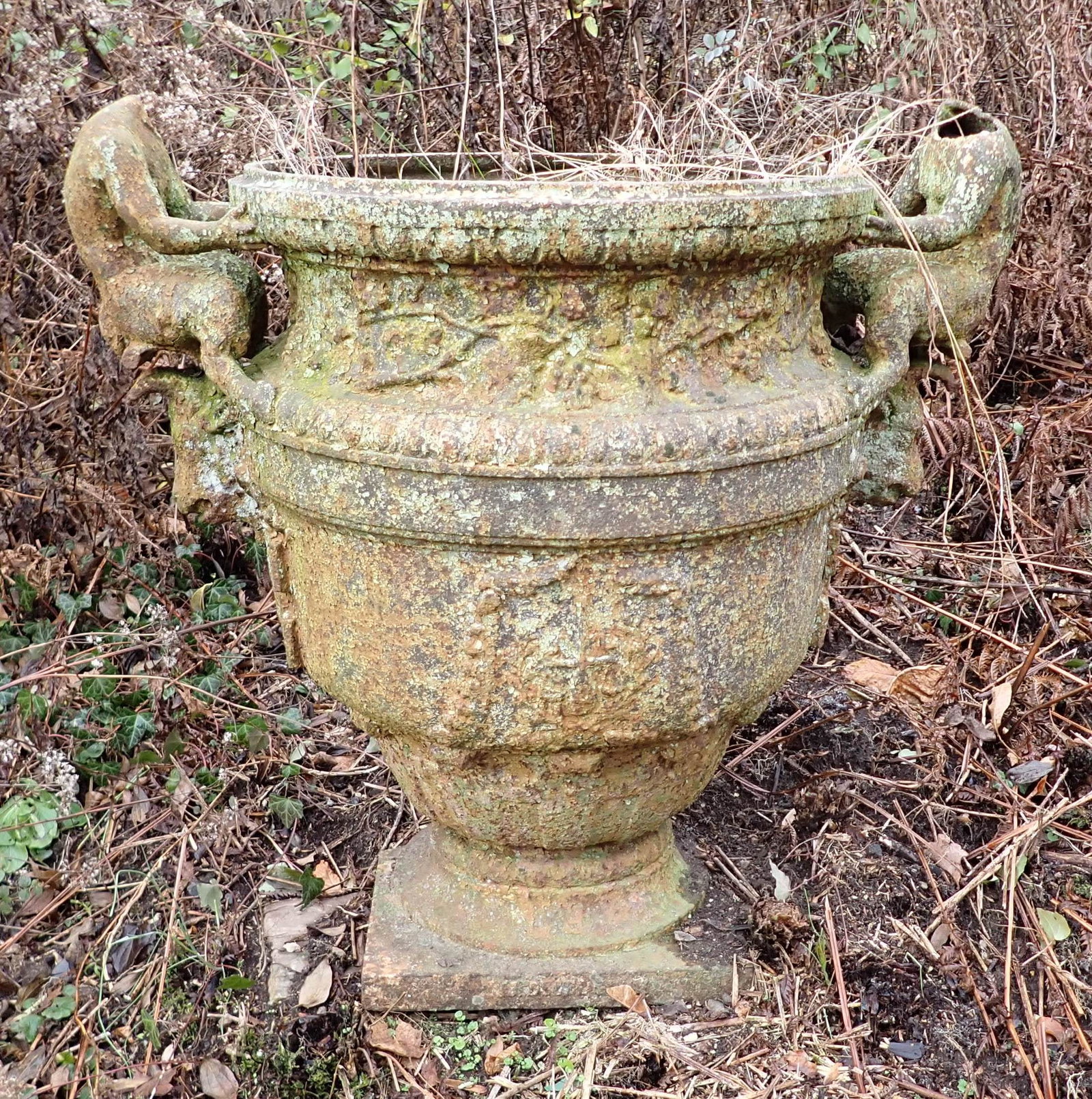 Cast Iron Garden Urn: If snow is on the ground by pickup time, it is buyers responsibilty to dig it out of snow or ice . Apprx 30" ( from outside of figure to outside of figure) and 30" tall. No shipping ! Bring help to lo