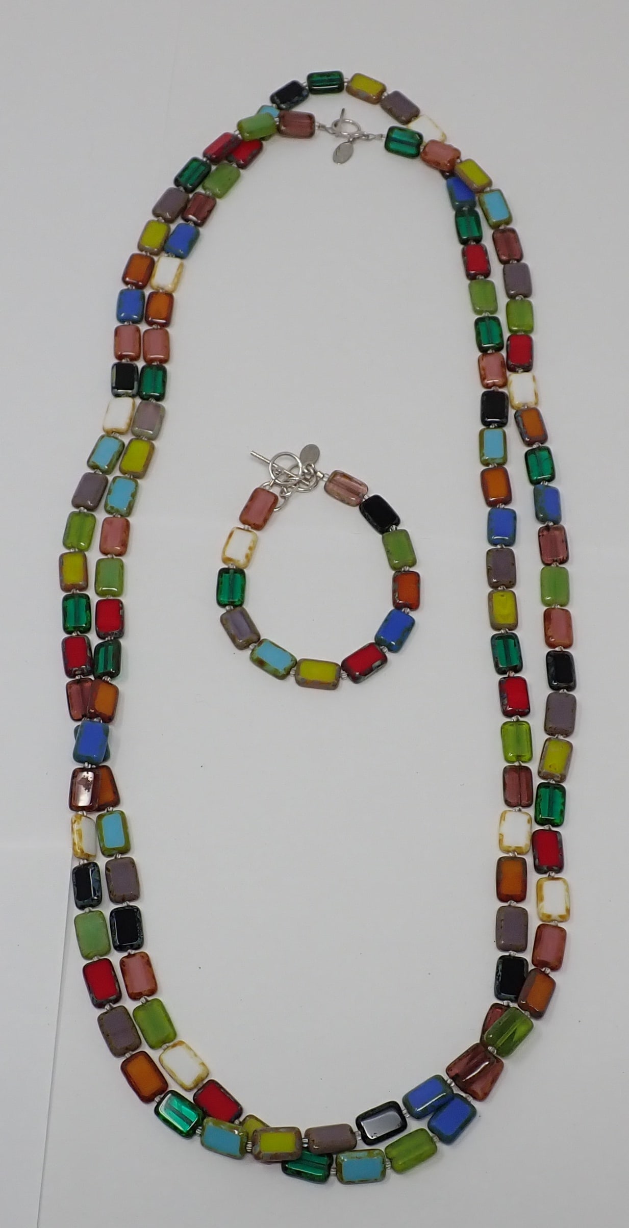 Stefanie Wolf Necklace and Bracelet: From the Art Institute Shop: "an array of petite Czech glass tiles", matching 62" necklace and 7"-8" adjustable bracelet, toggle closures.
