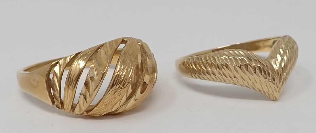 2 Gold Bands: Both 14K yellow gold, one with chevron form, the other a dome ring with cut-work, ring sizes 10 * 10-1/4, 5.74 dwt total