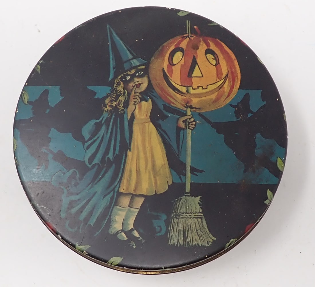 Tin Halloween Jack-O-Lantern Tin: Apprx 6" in diameter and 1 3/4" tall.