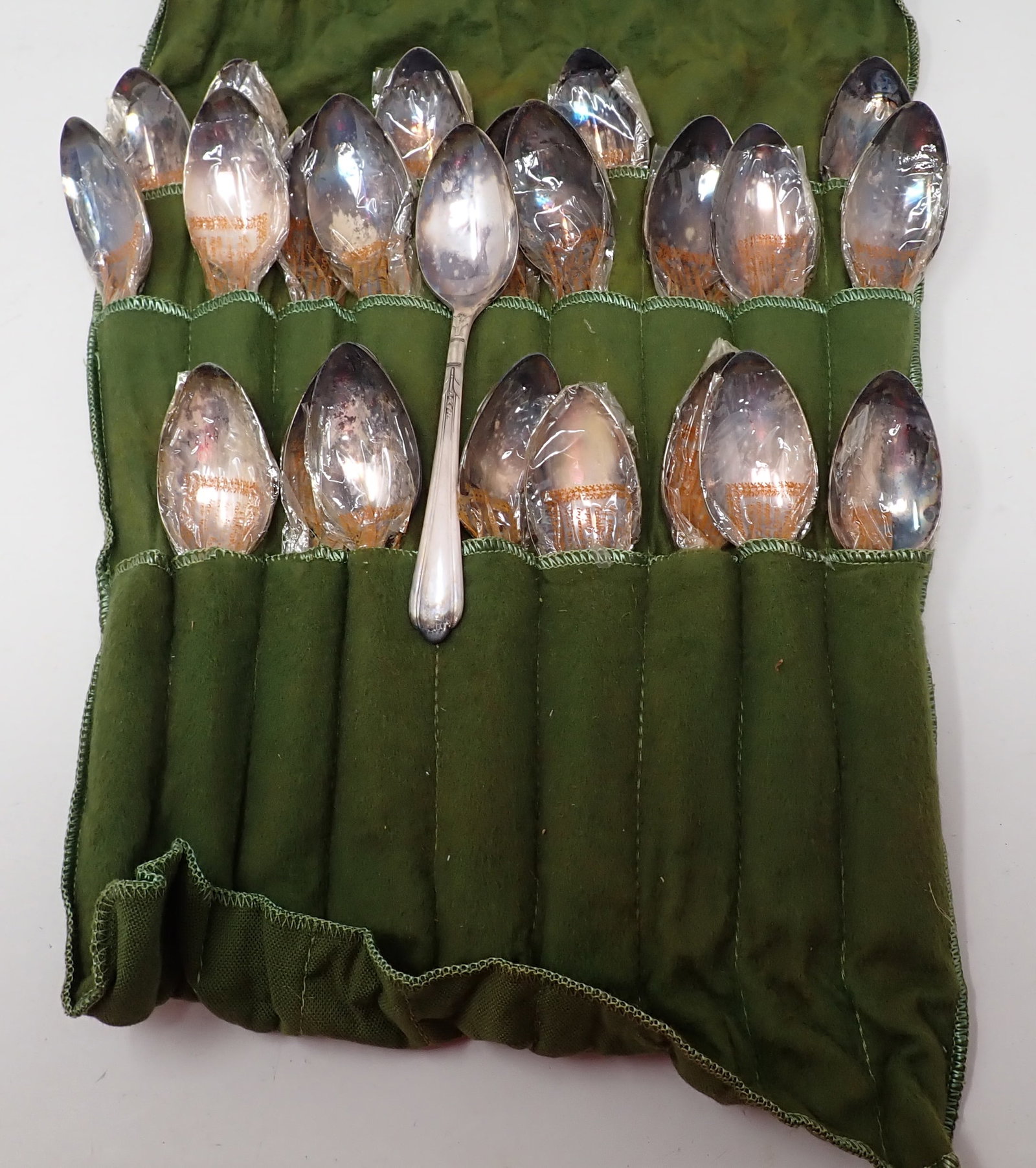 23 Oneida Tudor Plate Spoons: Approx 6" long. Most are still wrapped in plastic