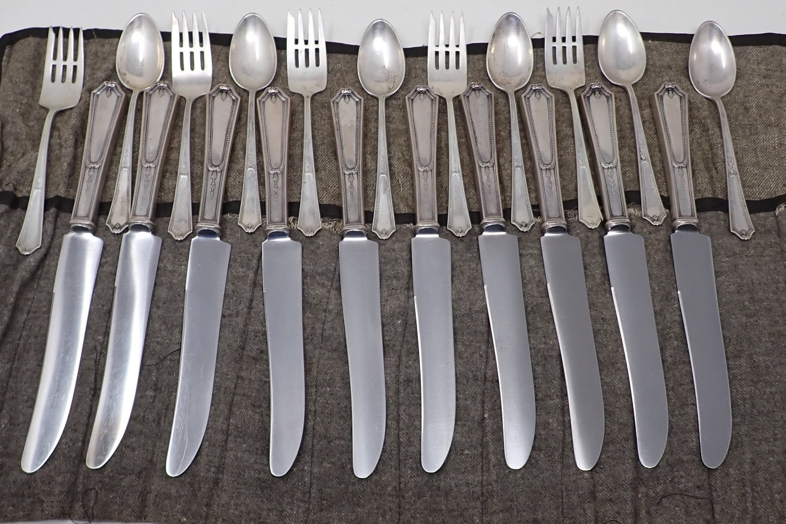 Sterling Silver Flatware: Forks and spoons weigh apprx 325 grams. Knives weigh approx 690 grams