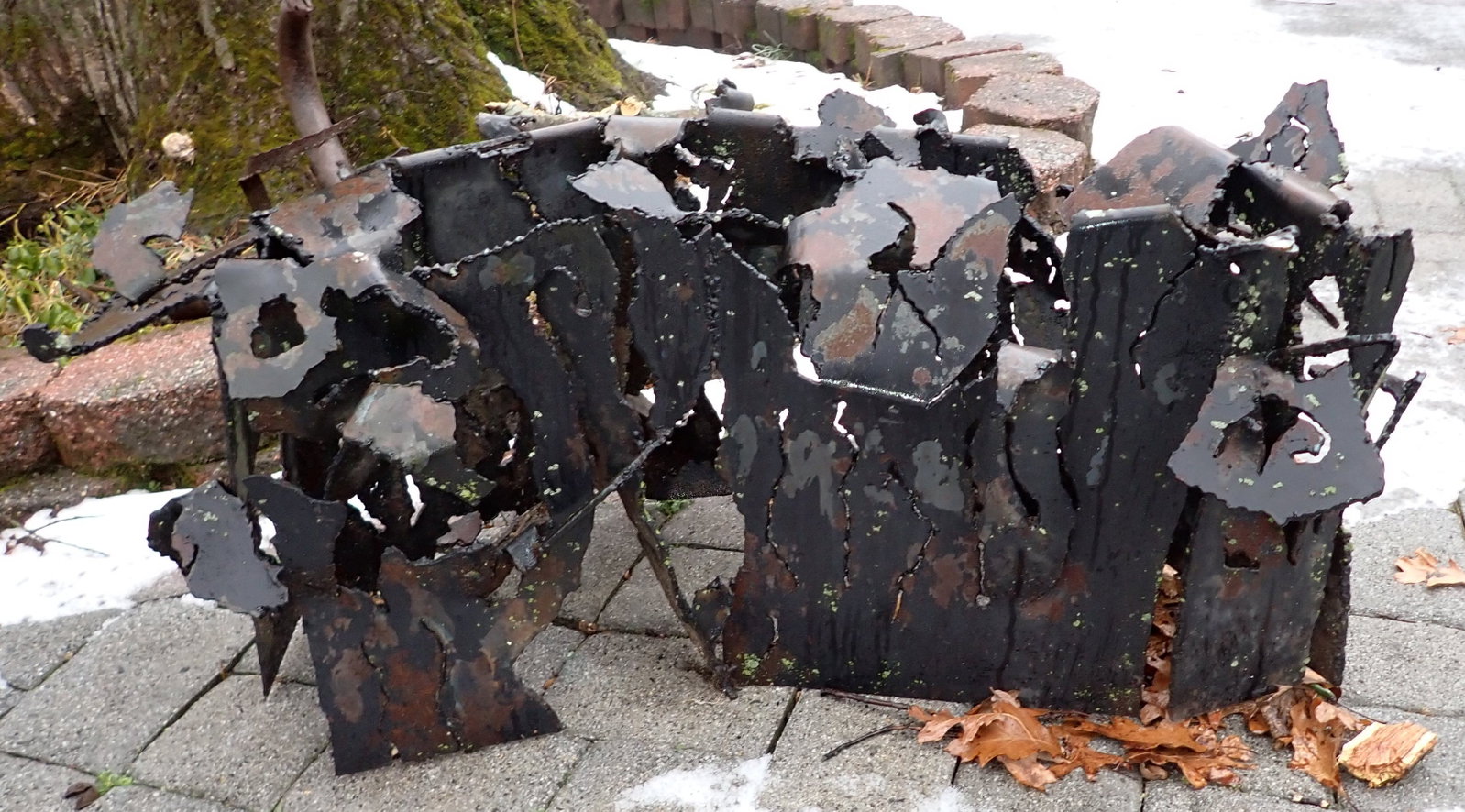 Steel Art Sculpture Table: Apprx 24" x 46" x 19" tall. Bring help to remove. If there is snow on the ground by pick up time, buyer to dig out. Also included is a piece of abstract iron art.