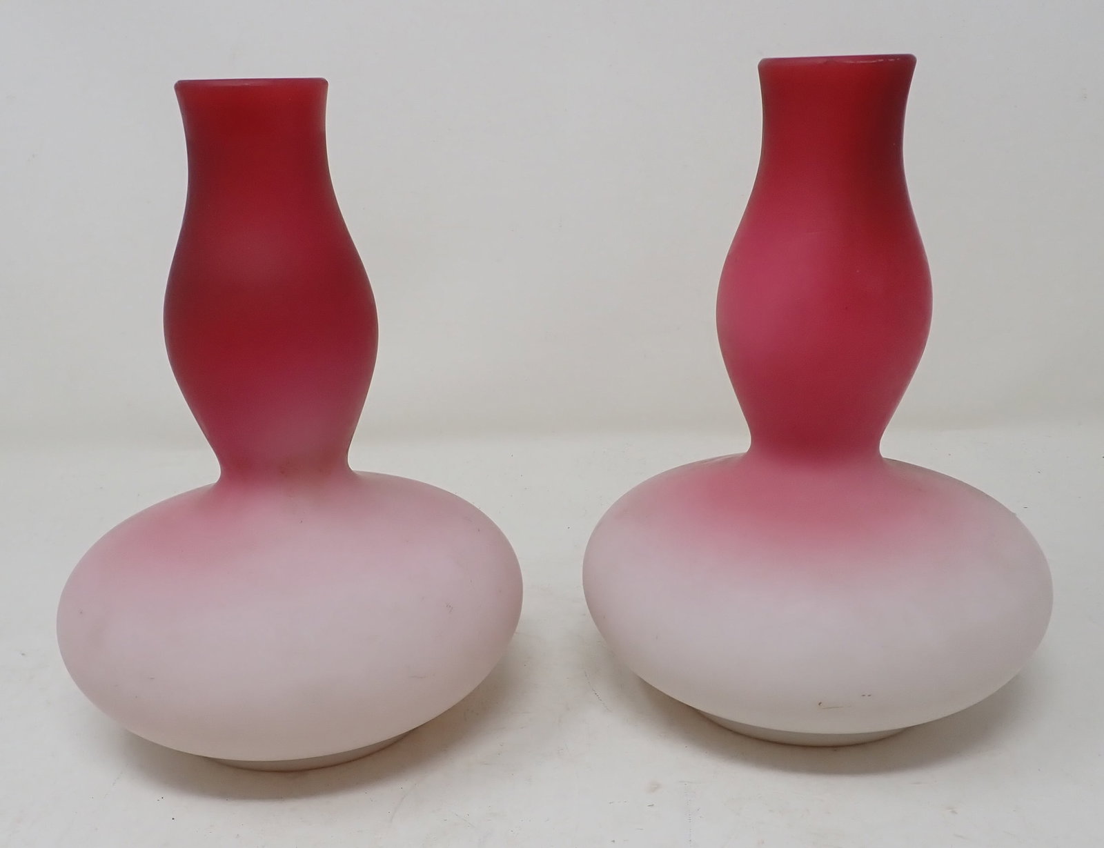 Pair of Cranberry Opalescent Vases: Approx 4 3/4" in diameter and 6 3/4" tall.