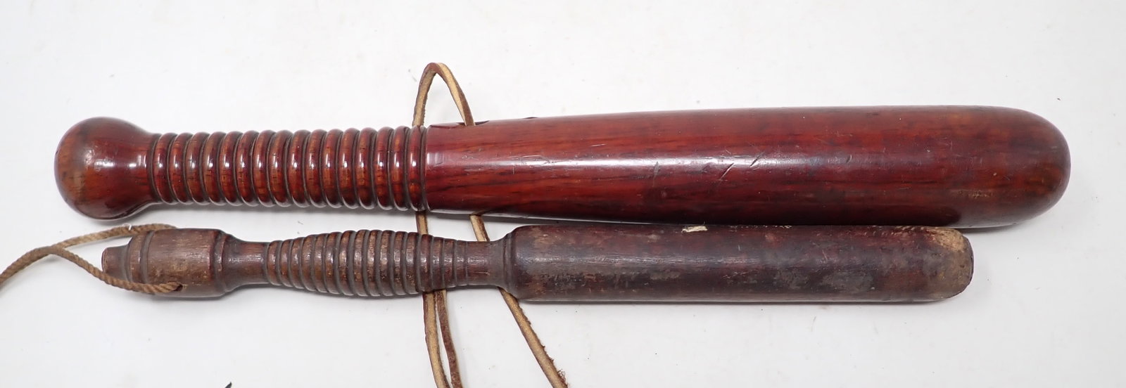 2 Billy Clubs: Largest is apprx 1 3/8" in diameter and 13 1/4" long