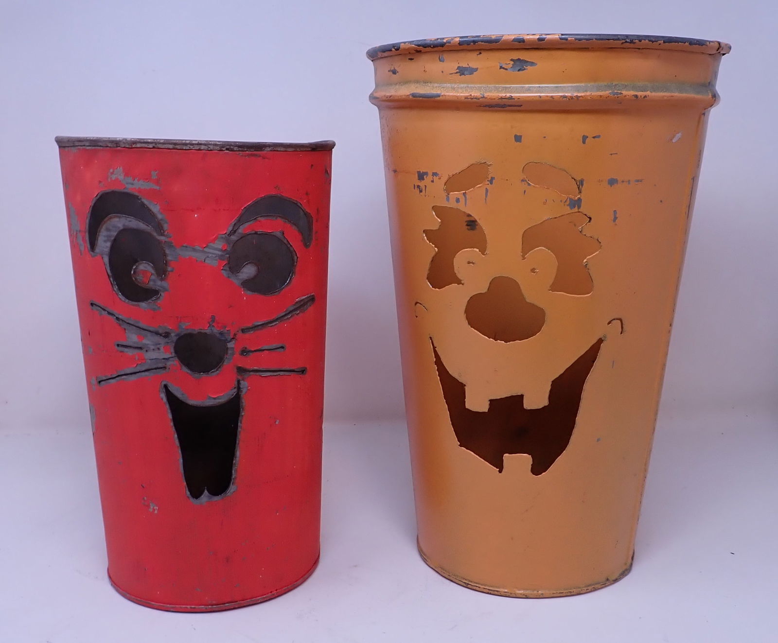 2 Halloween Cut out Cans: Largest is approx 8" in diameter and 12 3/4" tall.