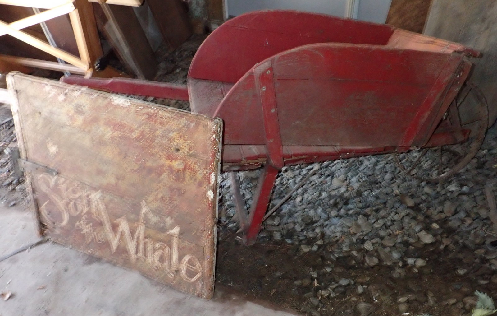 Wooden Wheel Barrow & Sign of The Whale: The sign is the backing to a piece of folk art. No shipping !