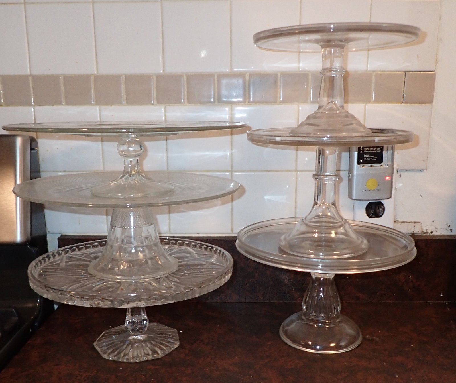 6 Cake Stands: Top left one is apprx 12" in diameter and 3 1/4" tall. NO SHIPPING !