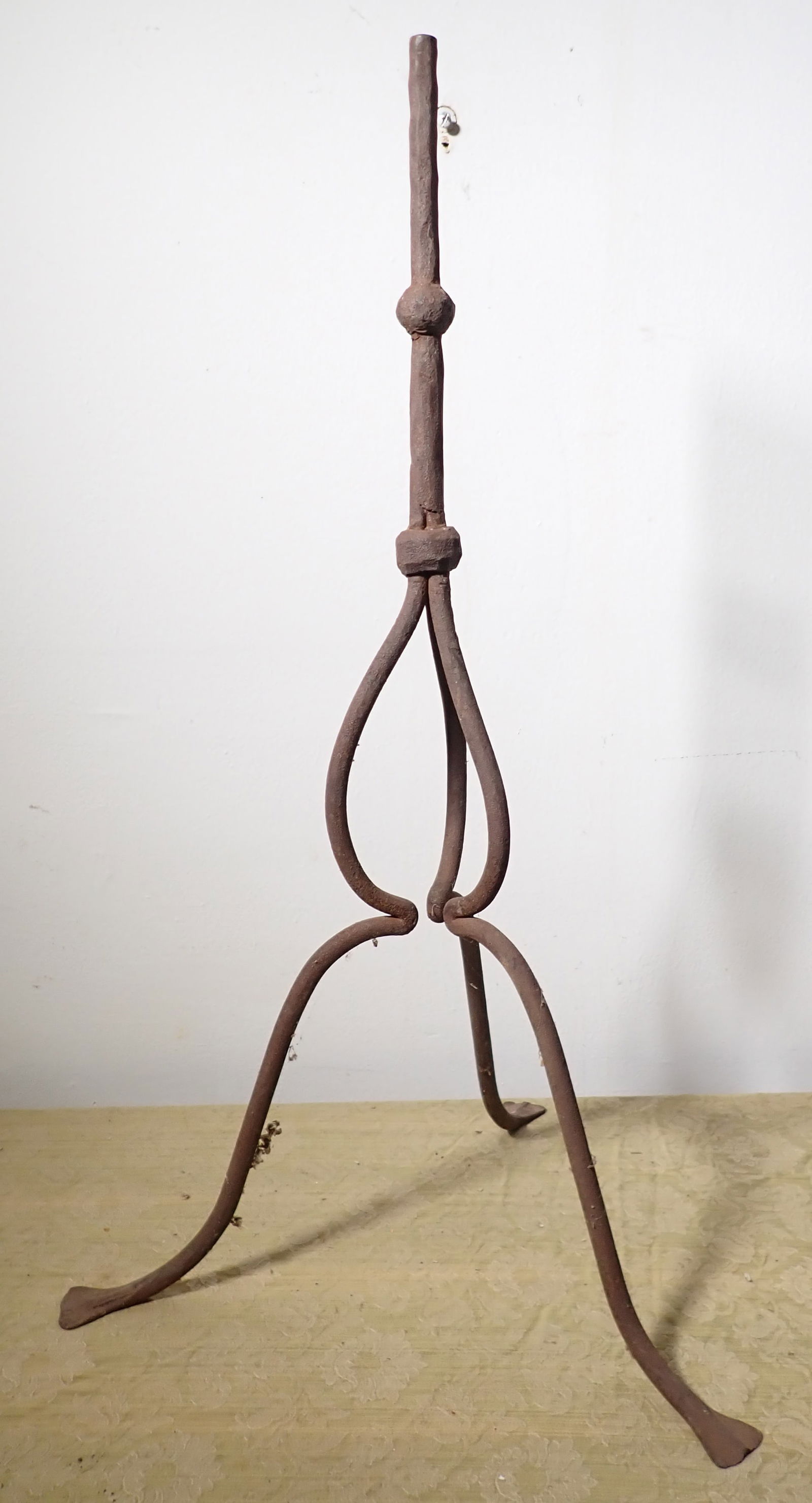 Early Wrought Iron Stand: Approx 16" outer foot to foot and 28 1/4" tall. Post is apprx 5/8" in diameter
