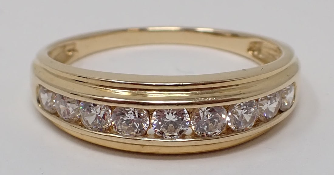 Man's Gold Band with Cubic Zirconias: 14K yellow gold with 9 chanel set CZ, ring size 11-1/4, 2.09 dwt.