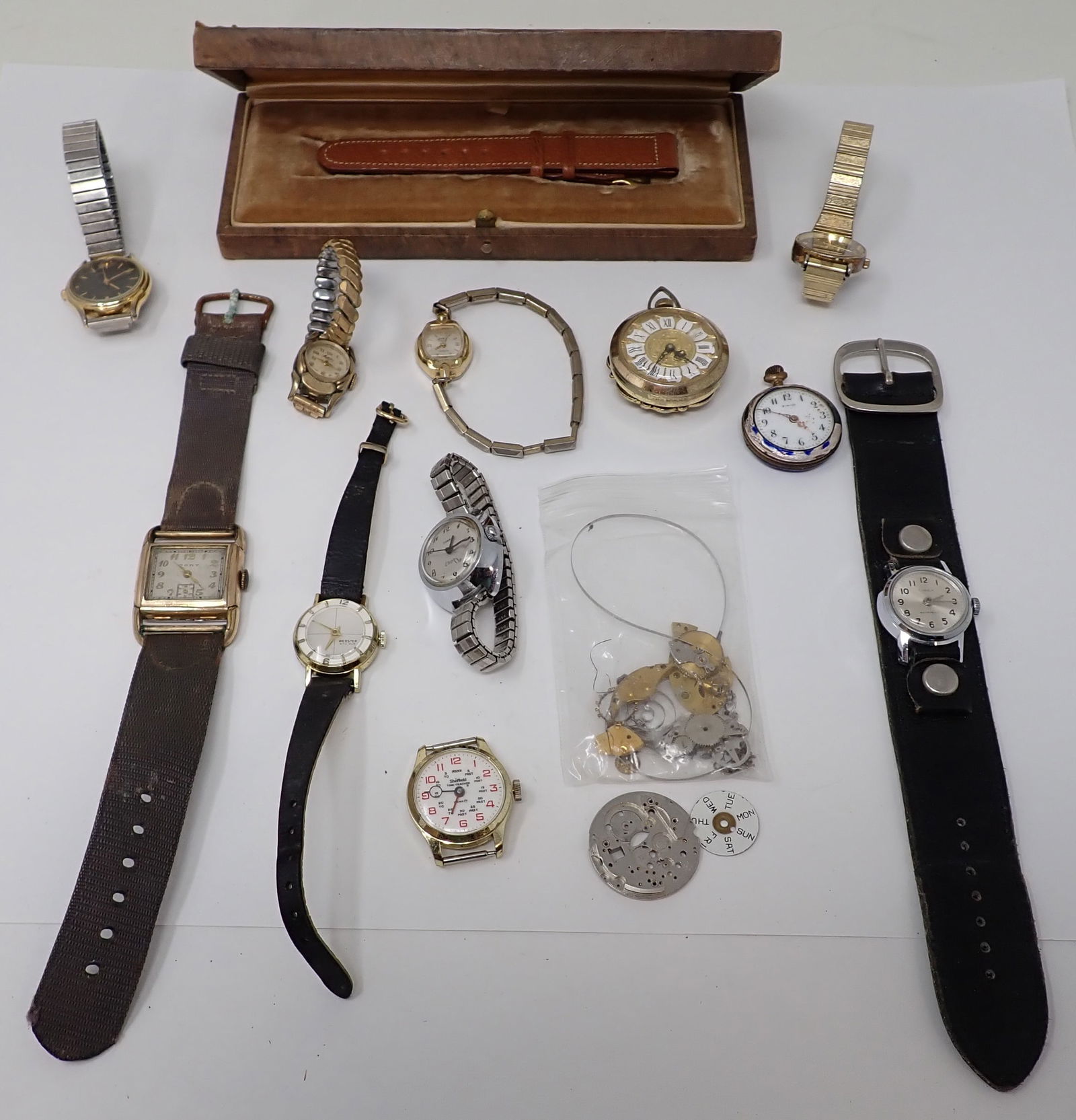 Wrist Watch Lot: Men's and Lady's wrist watches and parts. Includes Cort, Seiko, Webster 5th Ave, Timex, Waltham, Accent, Metron "17", Lucern fashion pocket watch, early silver and enael P.W. Co lady's pocket watch (a