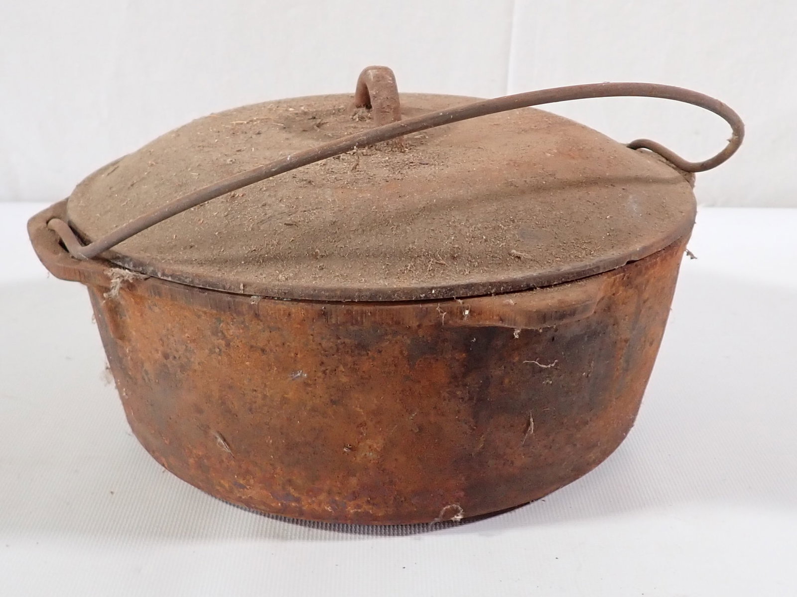 Cast Iron Dutch Oven: Approx 10 1/2" in diameter and 6 1/2" tall.