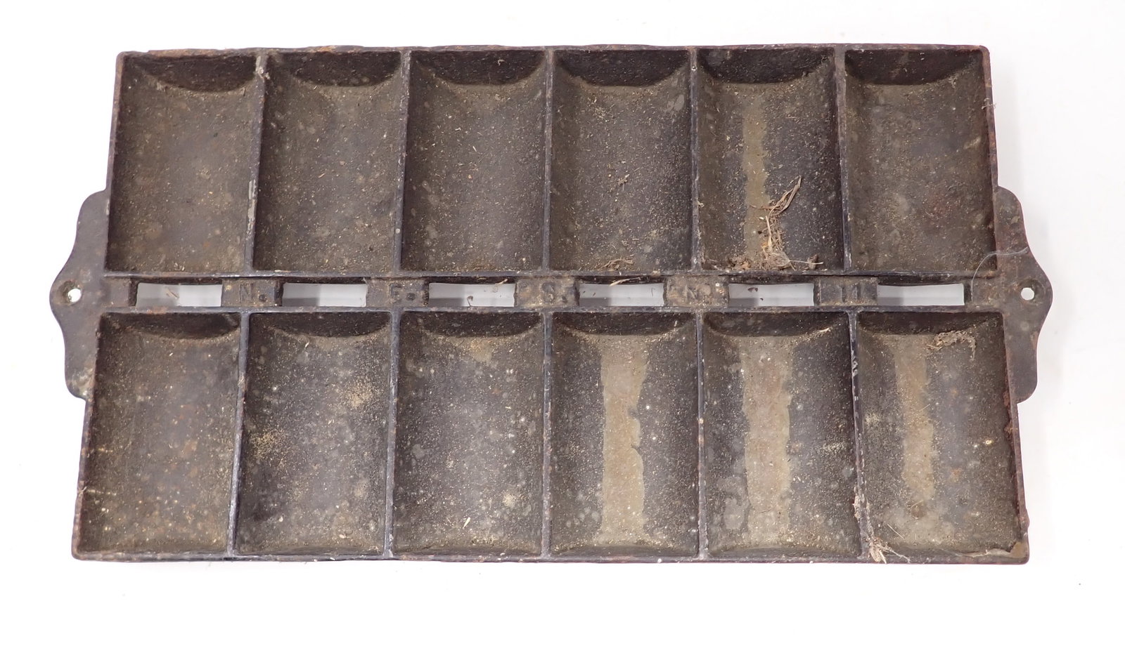 N.E.S No. 11 Cast Iron Roll Pan: Apprx 6 3/4" x 12 3/4"