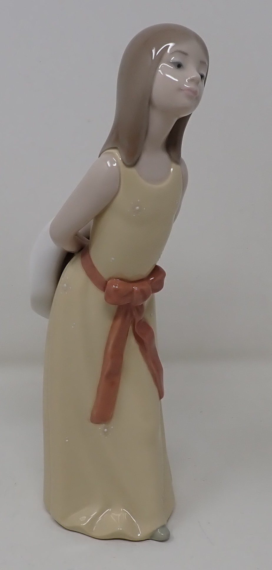 Lladro Naughty Girl: Approx 9 3/4" tall.