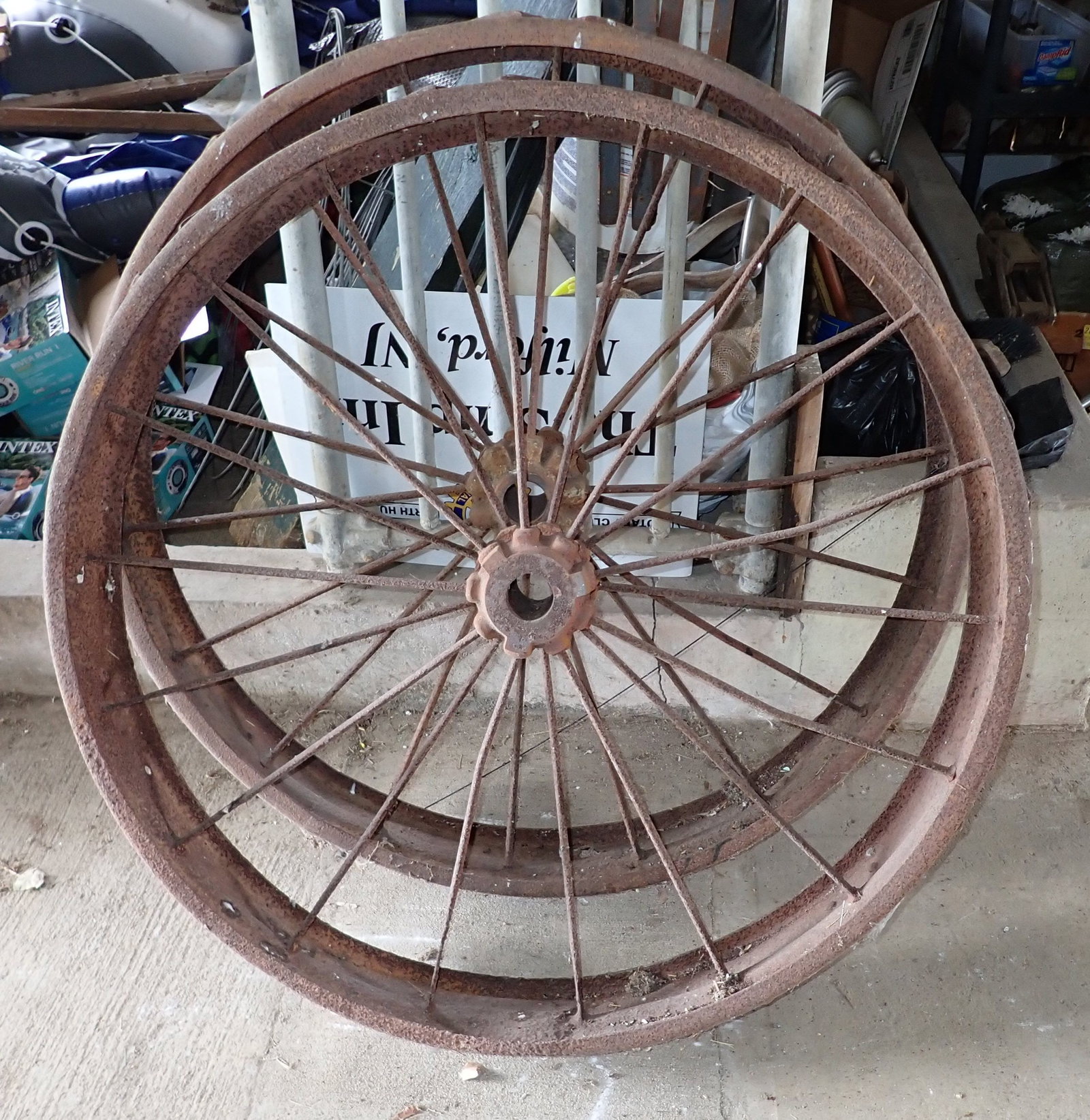 Pair of Steel Wagon Wheels: Approx 41" in diameter , 5 1/2" wide, shaft opening is approx 2" (tight). No shipping ! Pick up at 9:30am.