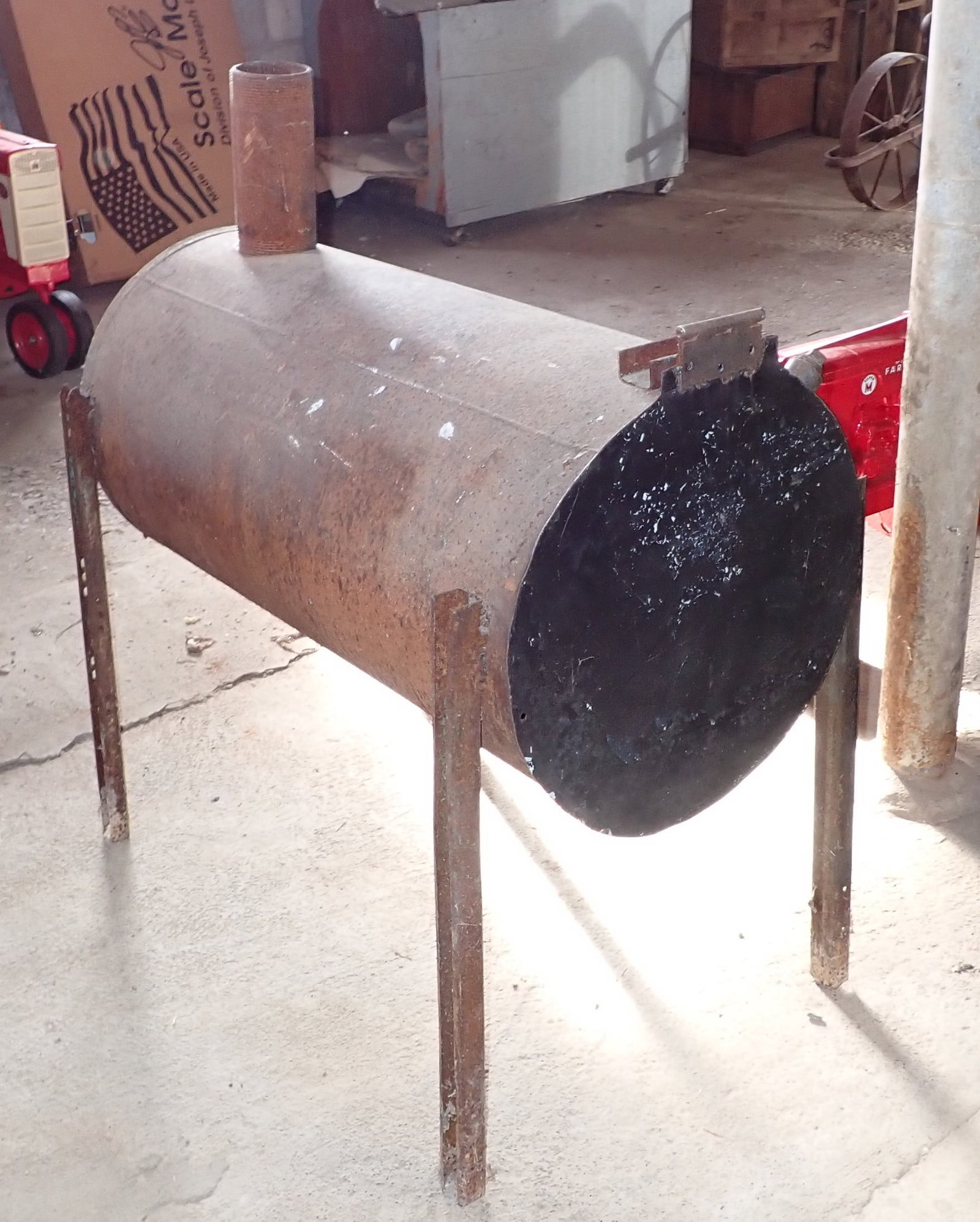 Home Made Woodstove: Approx 16" in diameter, 32 1/2" long, 37" to top of pipe. No shipping