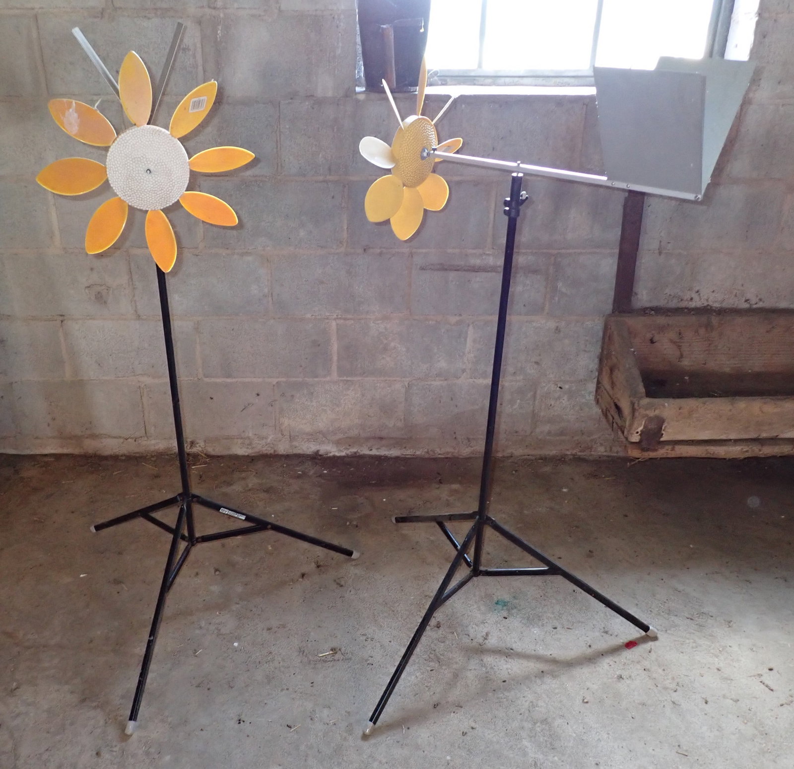 2 Flower Mills / Weathervanes: Approx 48" tall, 22" long, and plastic flowers are approx 13 1/2" in diameter. No shipping
