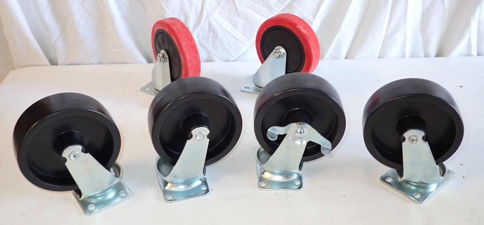 Swivel Casters: Black ones are approx 1 3/4" wide and 4 3/4" in diameter. Red ones are 4 3/4" in diameter and 1" wide.